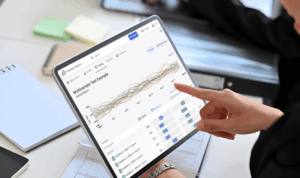 Pointing to laptop with application on the screen